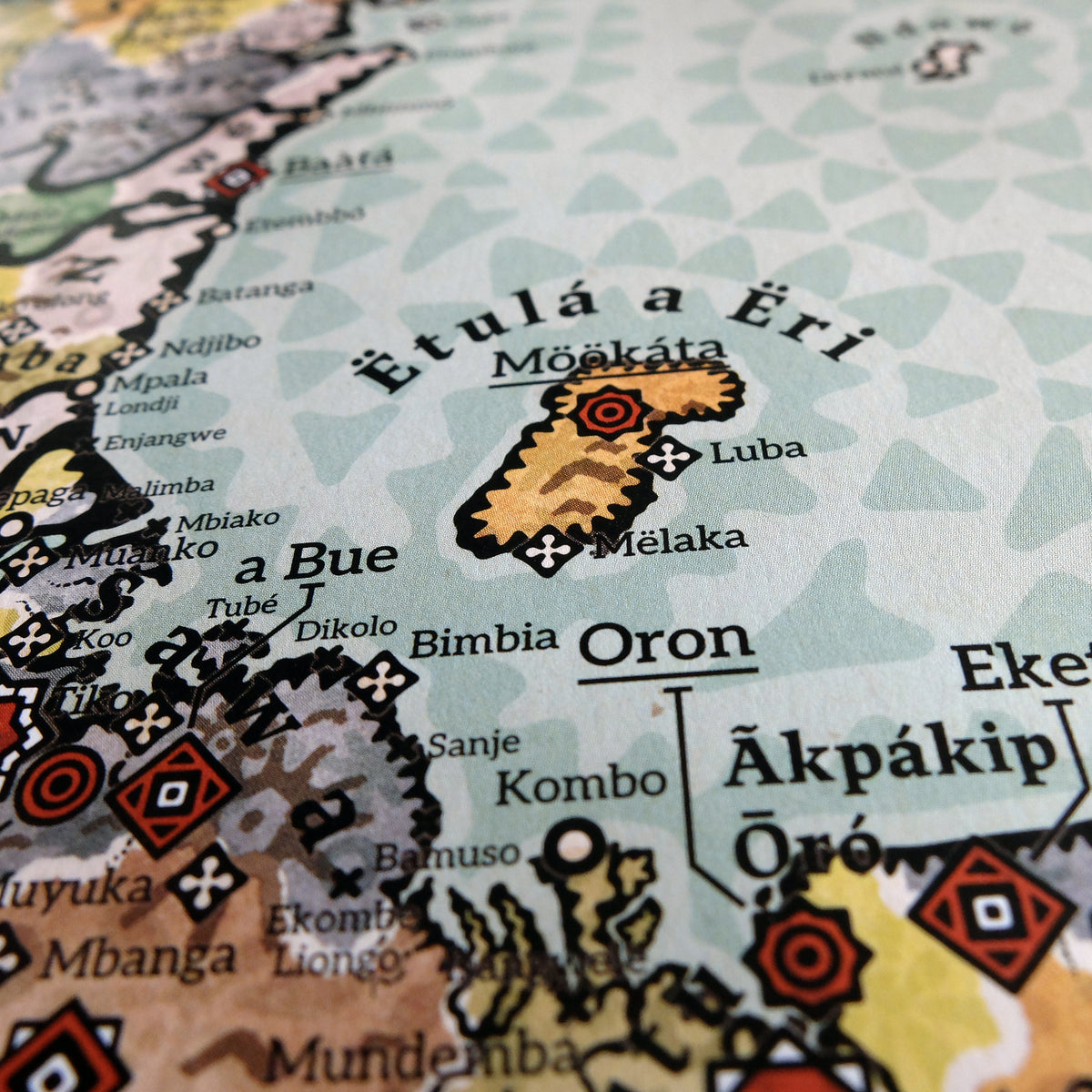 Detailed view of Bioko Island titled Ëtulá a Ëri in the Gulf of Guinea, highlighting the kingdom of Bubi, King Möókáta (King Moka), anti-colonial leader, alongside the Sawa kingdom, coastal settlements Bimbia, Luba, and Mëlaka, and Oron on matte paper print by Nikolaj Jesper Cyon.